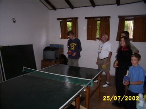 Many of my students were often late back to class after our breaks.  (This ping pong table was right outside the door.)  Typically, they played a game called "America".  They formed a line and walked around the table.  They took turns hitting the ball.  I didn't play, but Randall is trying it out above.