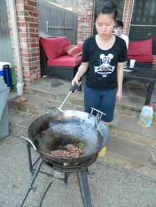 Jenny cooking the meat