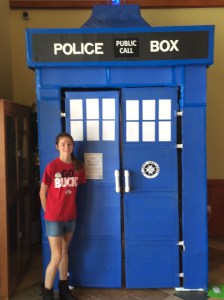 Abby standing next to the Tartis